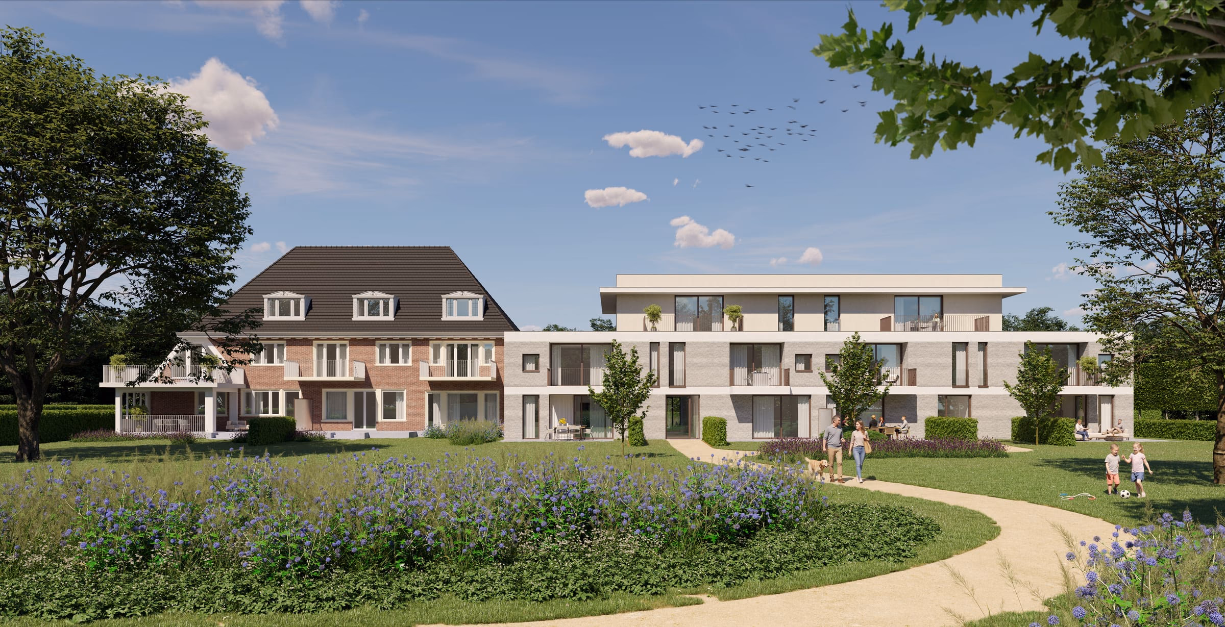 Wandelpad door de parktuin, met de dokterswoning en de nieuwbouw