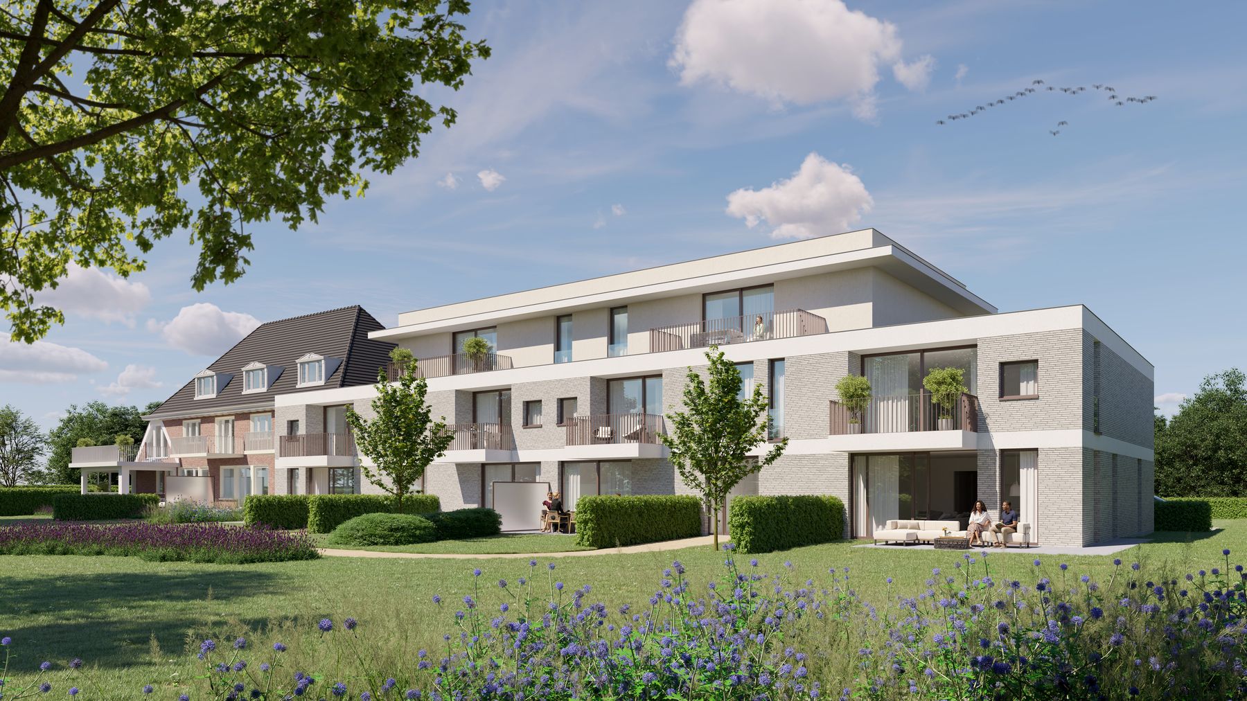 Terras van de nieuwbouwappartementen met zicht op de parktuin